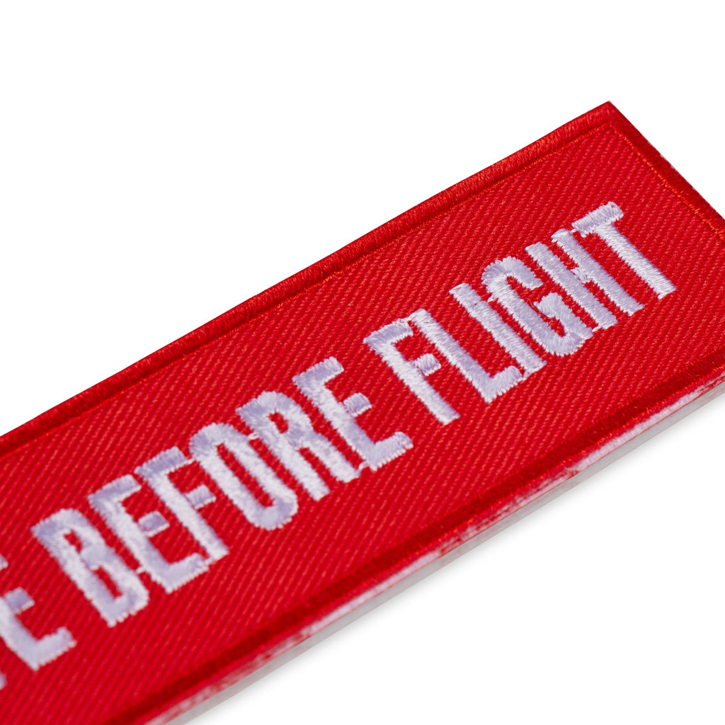 Schluesselanhaenger REMOVE BEFORE FLIGHT Passion detail