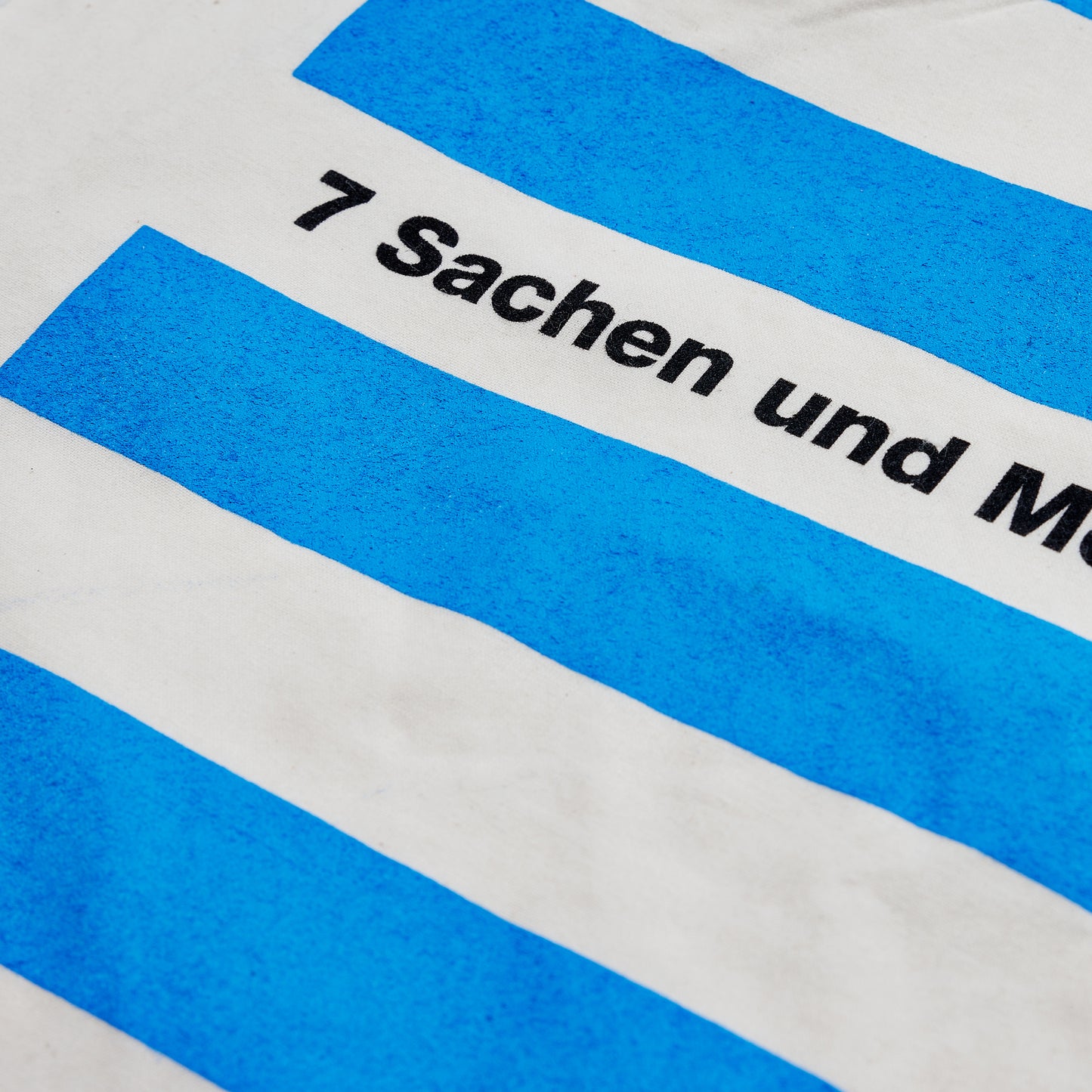 Baumwolltasche Condor SEA mit 7 Sachen und Meer