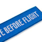 Schluesselanhaenger REMOVE BEFORE FLIGHT Sea detail
