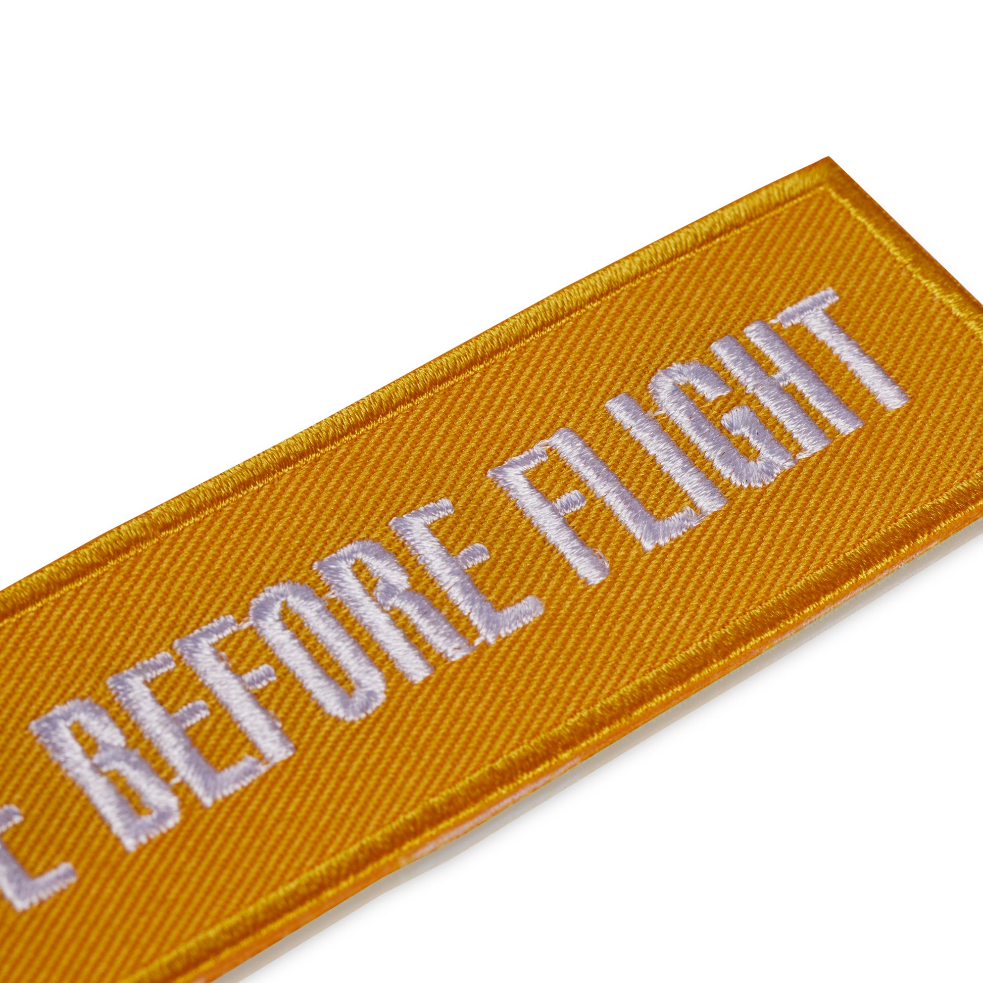 Schluesselanhaenger REMOVE BEFORE FLIGHT Sunshine detail
